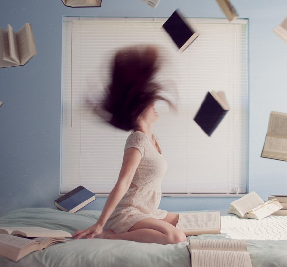 What is Visualization- Woman with psychic powers raising books in the air 