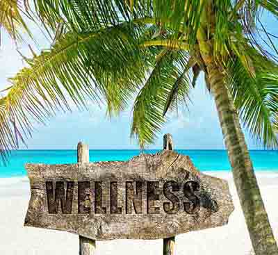 Wellness sign on a beautiful tropical beach