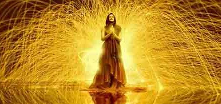Spiritual people surrounded by rays of golden light