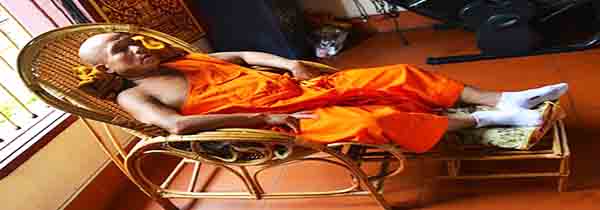 Bad to fall asleep during meditation- monk sleeping in reclining chair