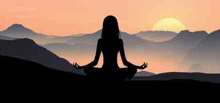 Why Can't I Meditate For Long- woman meditating in mountains with sun setting