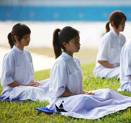 What To Do When Your Meditation Is Interrupted- 3 young girls meditating outside
