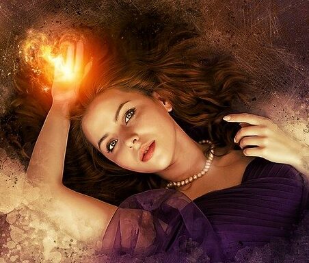 Manifest Multiple Things At Once- Womans Hand Glowing With Creative Energy