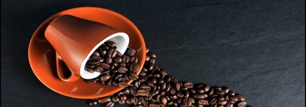 does coffee lower your vibration-coffee-cup-and-beans